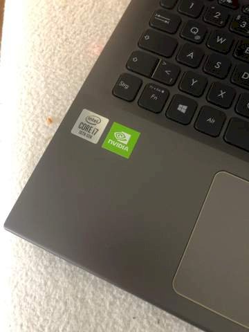 Can I remove the sticker next to the keyboard of a laptop